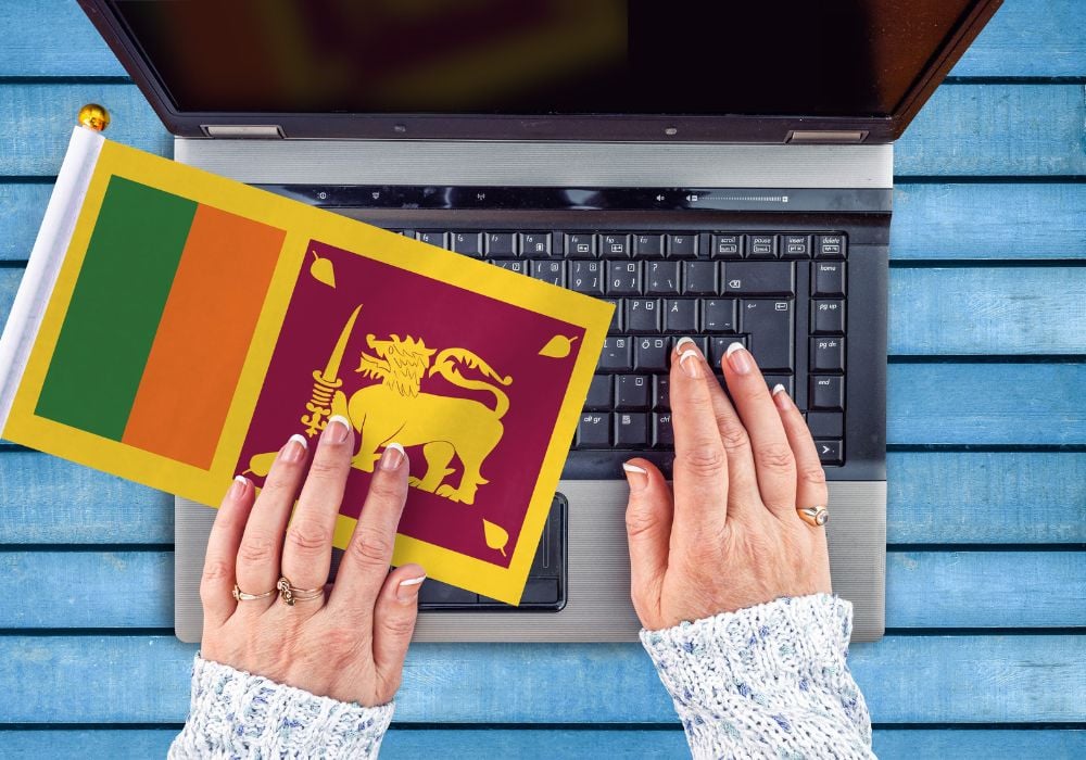 working in sri lanka as a digital nomad with a sri lanka flag and laptop