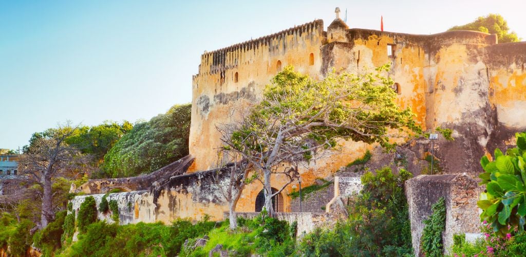 Fort Jesus in Mombasa with trees and greenery.